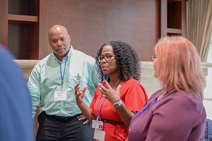 UNF new faculty members talking during faculty orientation