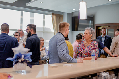 UNF faculty socializing at fall faculty orientation