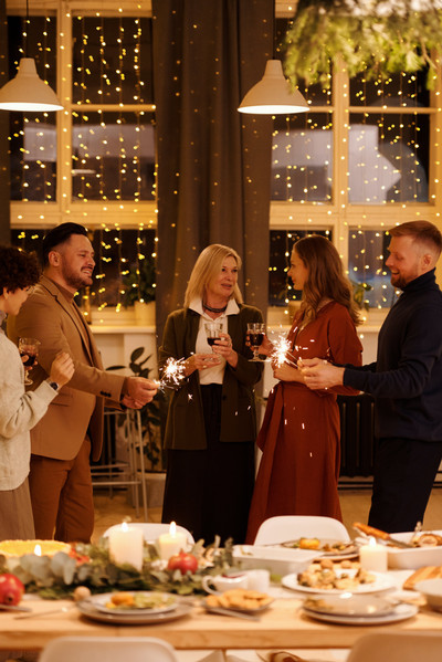 Friends chatting at a Christmas dinner