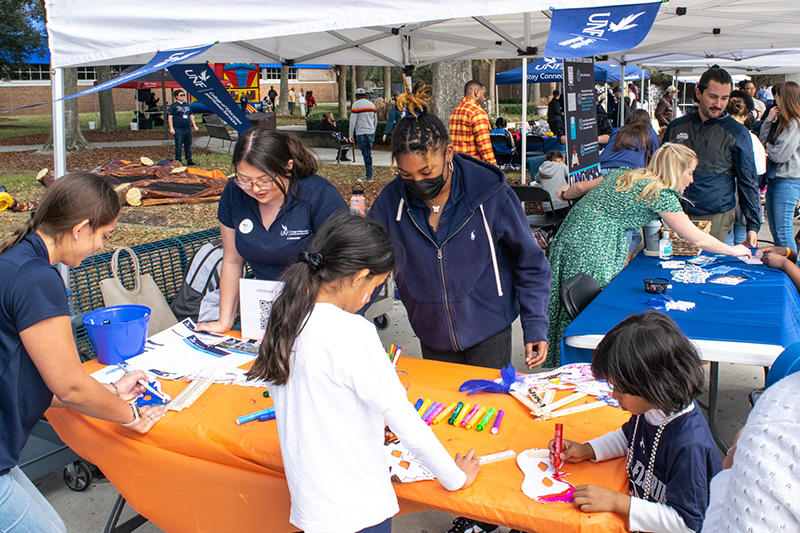 People enjoying Homecoming Village