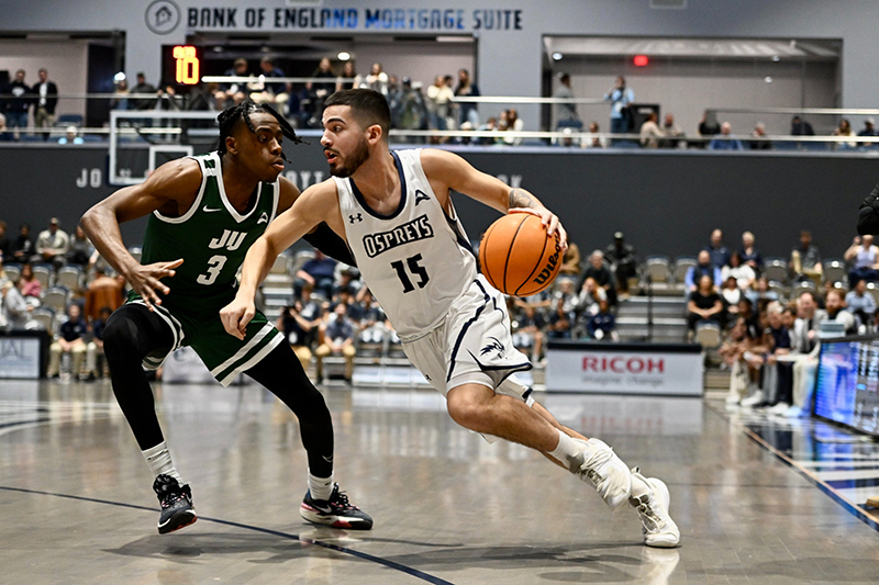 UNF men's basketball player driving to the basket