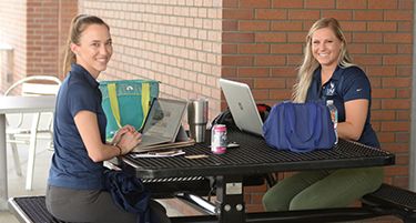 Students outside on computers