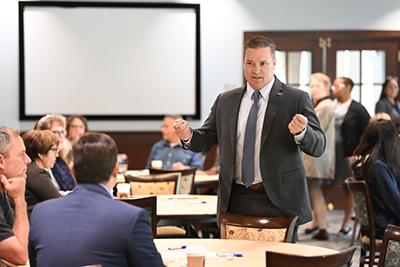 Brian Verkamp speaking to colleagues at a meeting