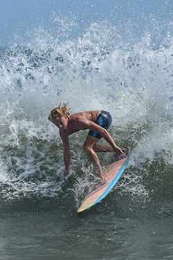 UNF surfer riding a wave