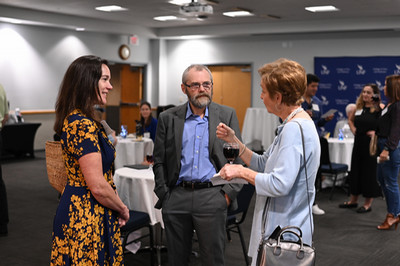 Dr. Josep Call speaking with lecture guests at UNF