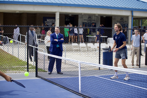 UNF President Moez Limayem looks on during a match at UNF's pickleball courts