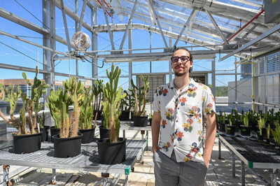 UNF 2024 graduate Corey Kempinski standing in an atrium