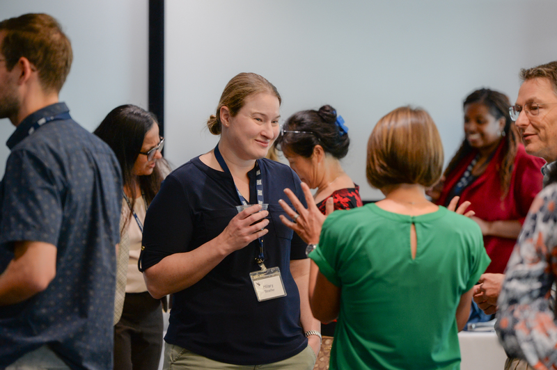 UNF faculty and leadership socializing at a new faculty reception event