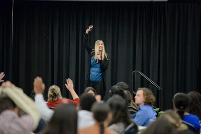 Speaker on stage at the 14th annual Florida Undergraduate Research Conference talking to the audience