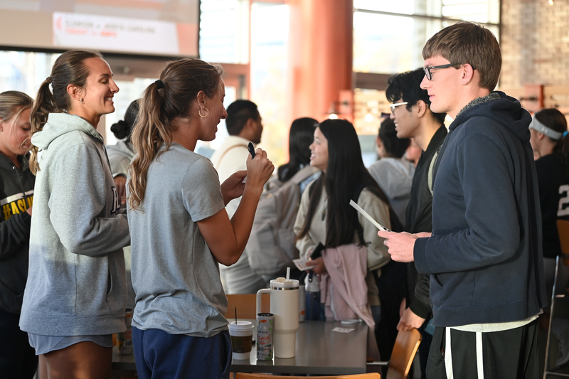 UNF students gathering at The Boathouse for a Meet the Teams homecoming event