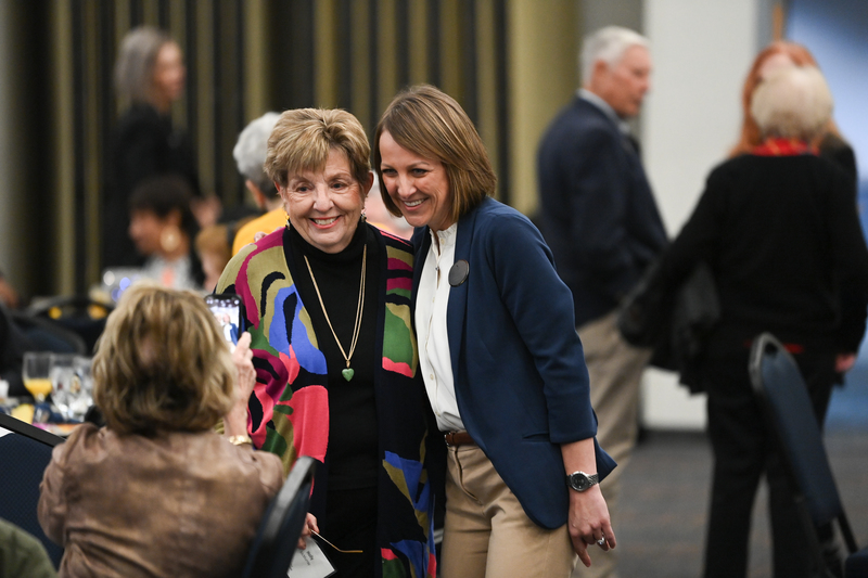 Two ladies posing for a photo at the 2024 UNF Emeriti Luncheon