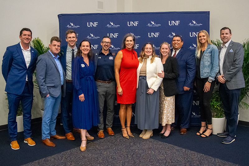 UNF staff members at an alumni awards event