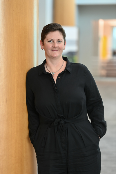 Dr. Sarah Mattice leaning on a column