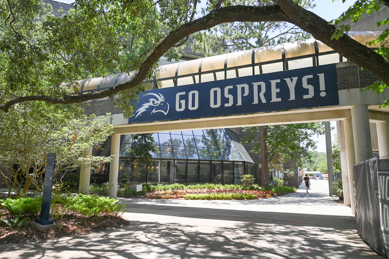 Go Ospreys! sign on UNF campus outside of the campus Starbucks