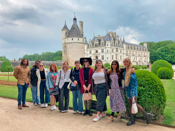 UNF students and faculty standing in front of a castle