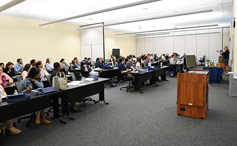 Audience at the 2024 UNF Marcom Summit listening to a speaker 