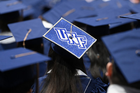 UNF commencement showing the back of caps
