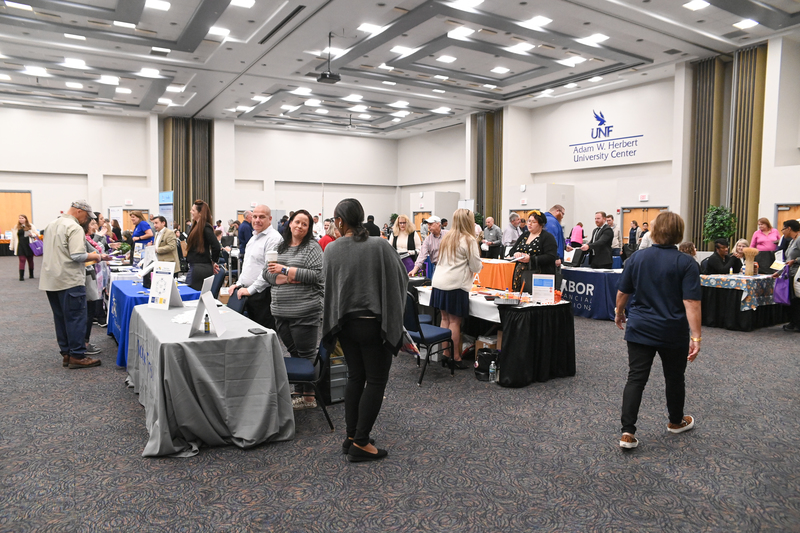 UNF benefits fair event with people visiting vendor tables