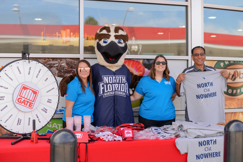 Ozzie and Gate gas station reps giving away UNF North or Nowhere shirts at the gas station