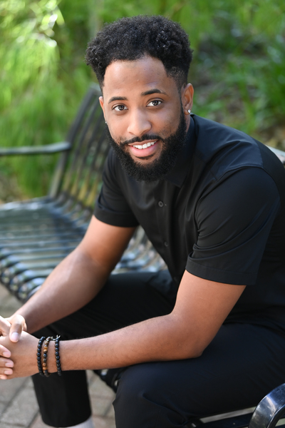 Dorian Drummond sitting on a bench