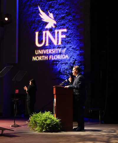 UNF President Moez Limayem speaking on stage at Convocation 2024