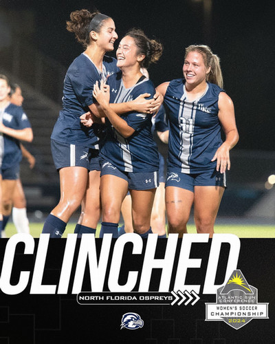 UNF women soccer players celebrating and hugging on the field
