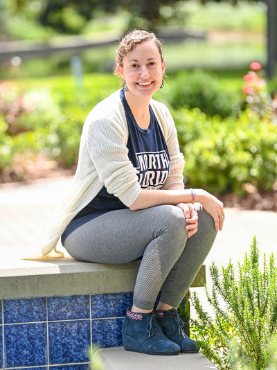 Jennifer Wells sitting outside at the UNF campus