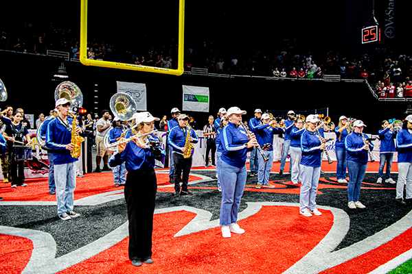 Band performing on a football field