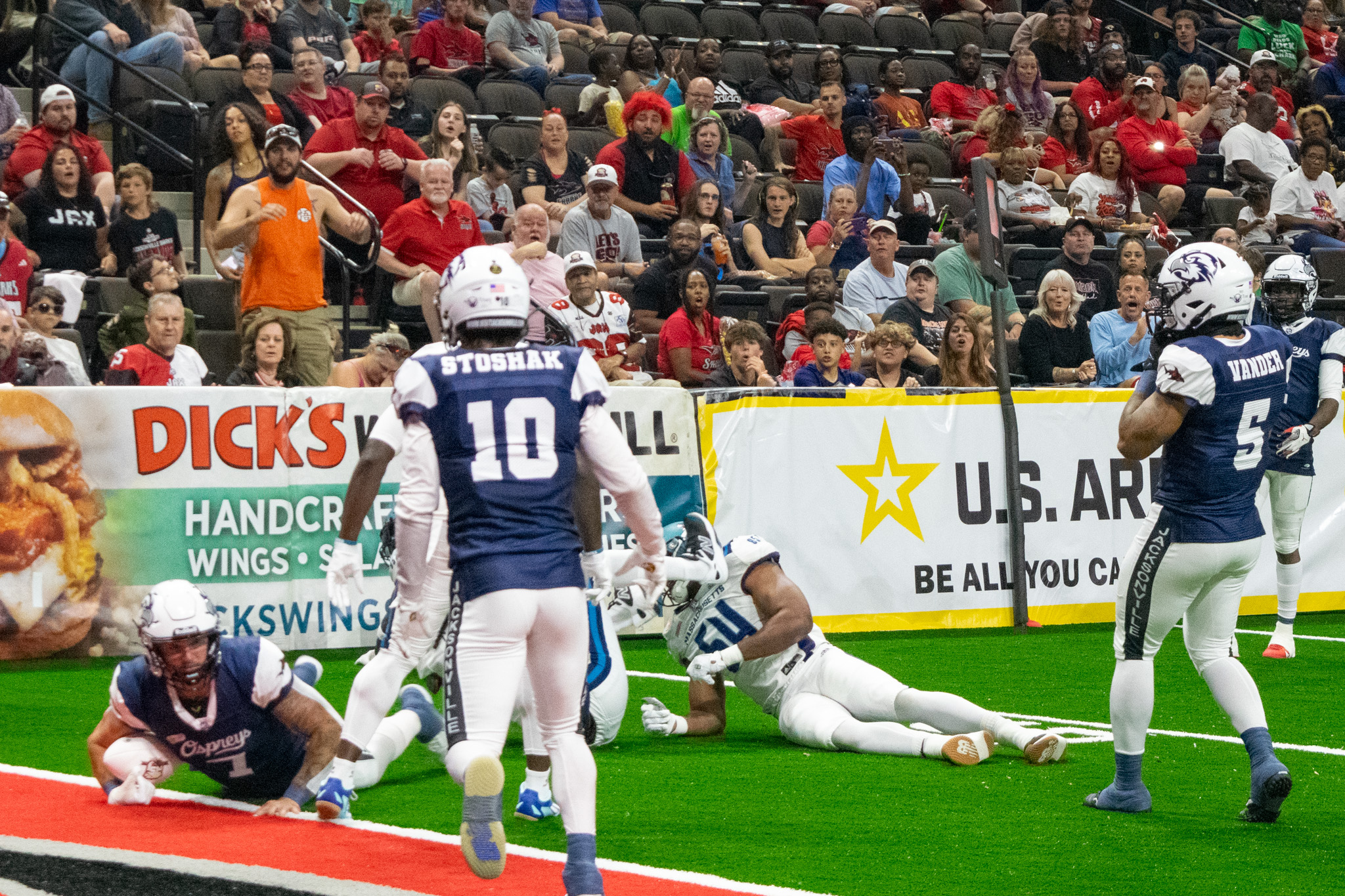 Jax Sharks player on the ground in the end zone with the ball