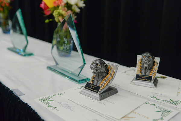 Various trophy awards displayed on a table