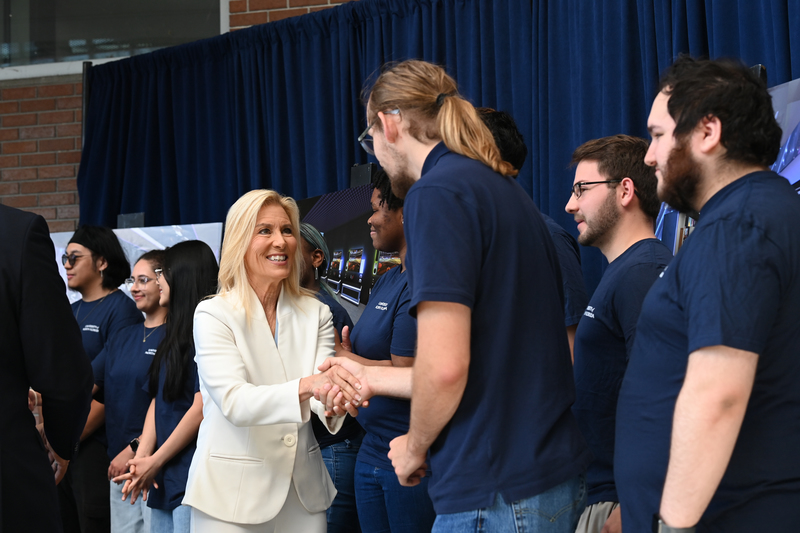 Jax Mayor Donna Deegan shaking hands with a UNF student