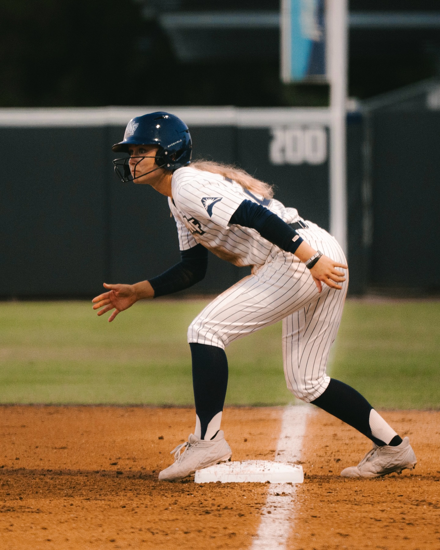 UNF softball player standing on a base