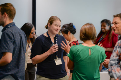 UNF faculty conversing at an event