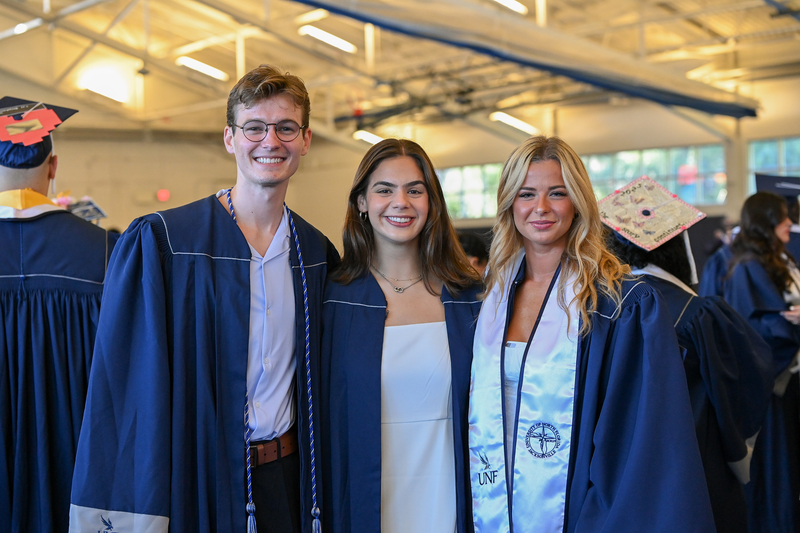 UNF graduate walking during commencement