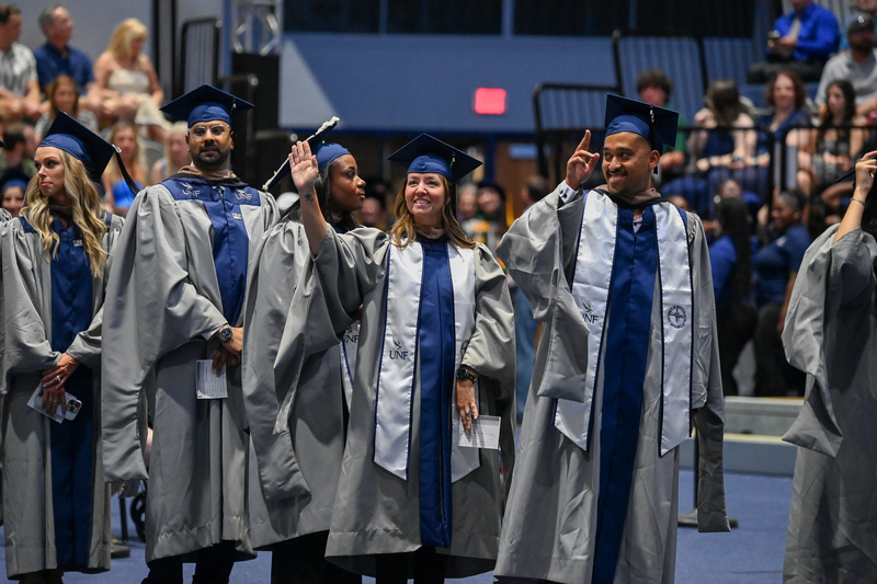 UNF graduate students walking into commencement