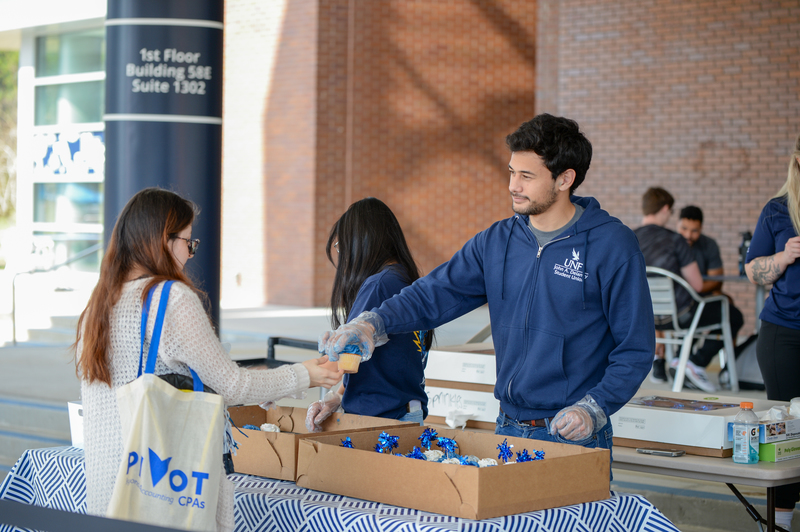 Two UNF students conversating at Market Day event at Student Union