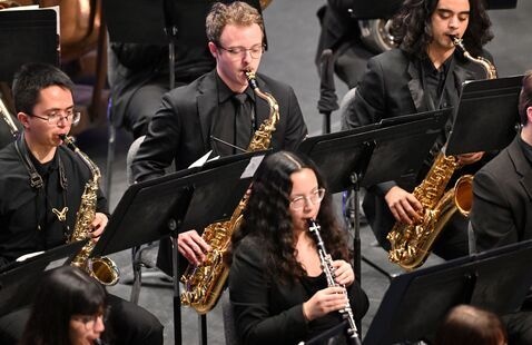UNF students in concert playing various wind instruments