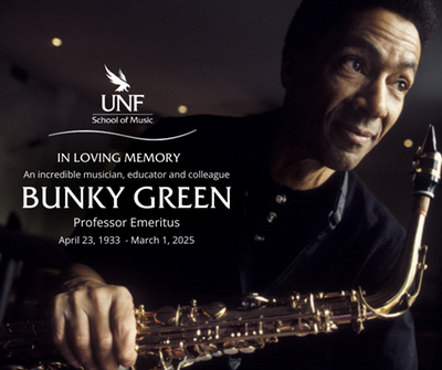 Musician Bunky Green holding a saxophone looking into the distance