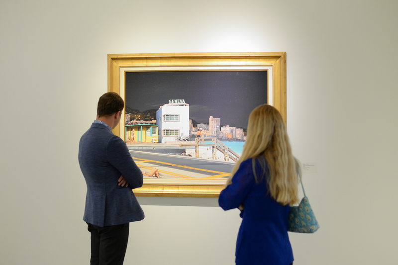 Man and woman looking at a museum painting