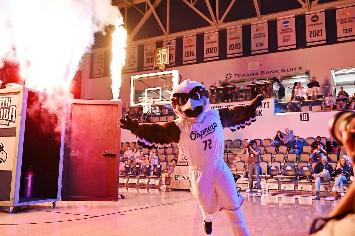 Ozzie the Mascot running on the basketball court
