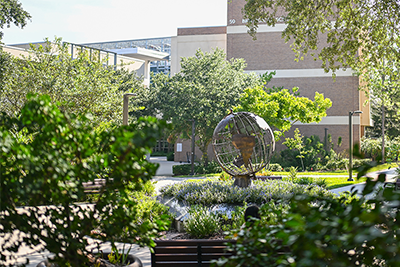 Globe statue outside of the UNF Biological Sciences building
