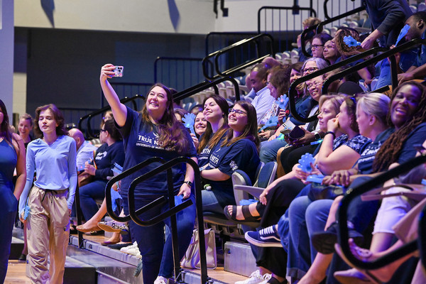 Woman taking a selfie at UNF Convocation 2025