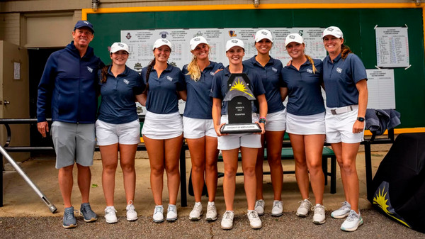 UNF Womens Golf team posing with ASUN Championship trophy