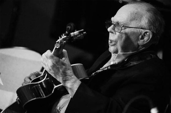 Jack Petersen holding a guitar