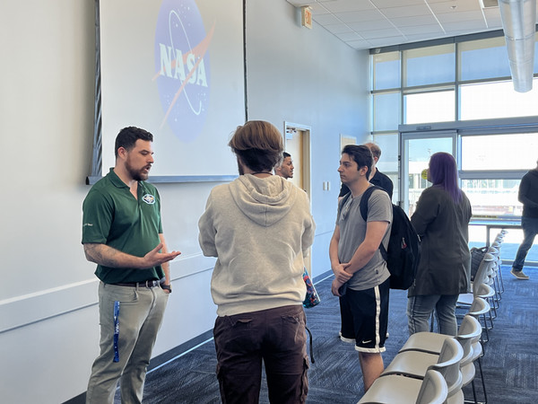 NASA representative speaking with UNF students