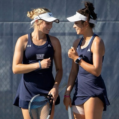 UNF Women's Tennis players in uniform