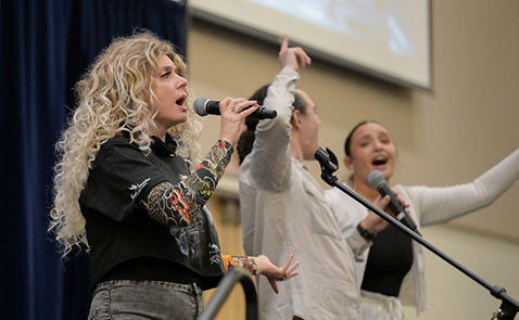 Three UNF employees singing at an Ospreyoke event