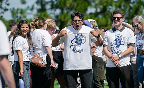 UNF employees in white T-shirts at Feathering the Nest employee photo event