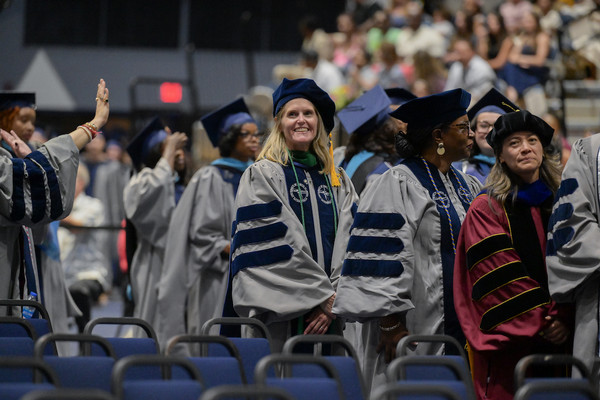 UNF students at commencement looking into the audience