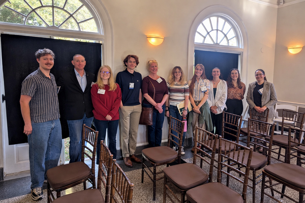 UNF students and faculty who presented at the symposium standing together